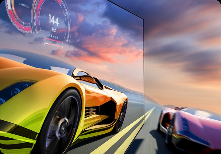 레이싱 중인 자동차가 보입니다. 왼쪽의 차는 선명하게 보이며, 오른쪽에 차는 흐릿하게 보입니다.