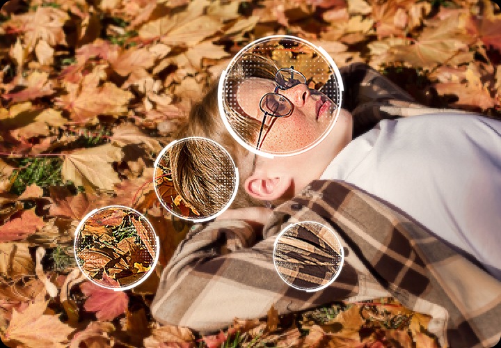 소년이 나뭇잎 위에 누워 있습니다. 나뭇잎, 머리카락, 안경, 옷에 동그라미가 처져 있습니다.