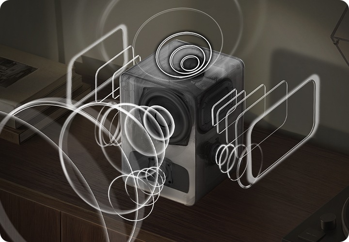 장식장 위에 스피커가 놓여 잇습니다. 스피커 오른쪽에는 턴테이블이 놓여 있고, 왼쪽에는 책들이 놓여 있습니다. 스피커에서는 음향효과가 나오고 있습니다.