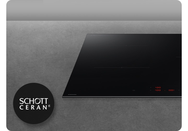 진한 회색의 대리석을 배경으로 이미지 오른쪽 부분에는 인덕션의 정면 이미지가 약간 잘려서 위치하여 있고 이미지 왼쪽 부분에는 SCHOTT CREAN ® 로고가 반영되어 있습니다.