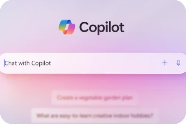 Copilot 로고 아래에 'Chat with Copilot'이라고 쓰인 검색 입력창이 중앙에 표시되어 있으며, 흐릿한 배경에는 예시 질문들