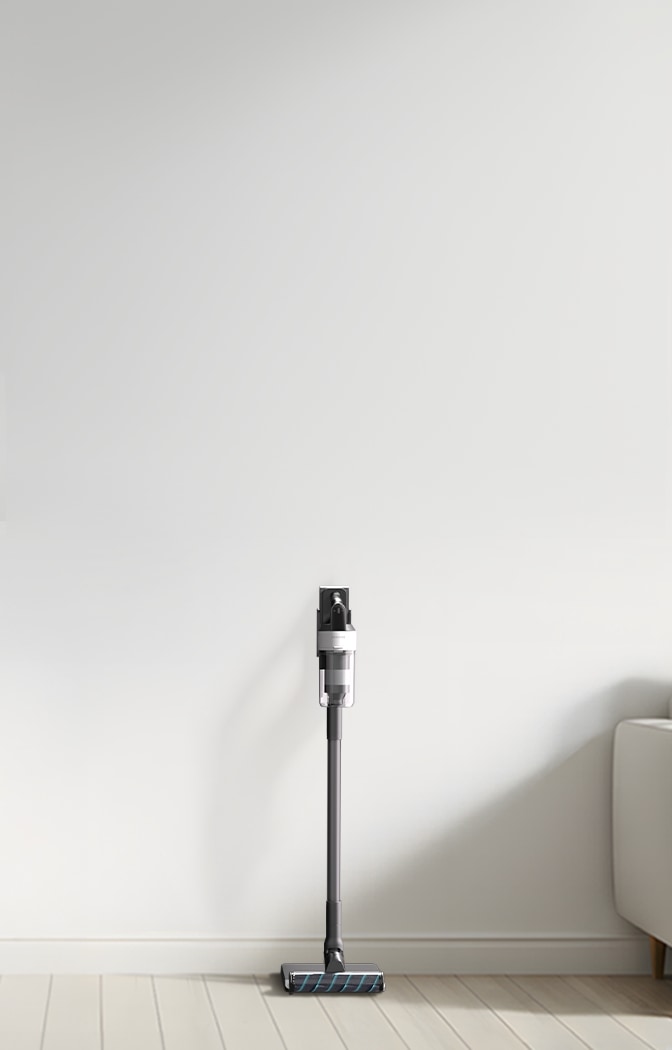 베이지 톤 거실 맨 우측에 소파가 배치되어 있으며, 그 옆에 배치되어 있는 제트 핏