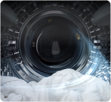 세탁기 문이 열려있고 바람이 들어오는 세탁기 안의 모습