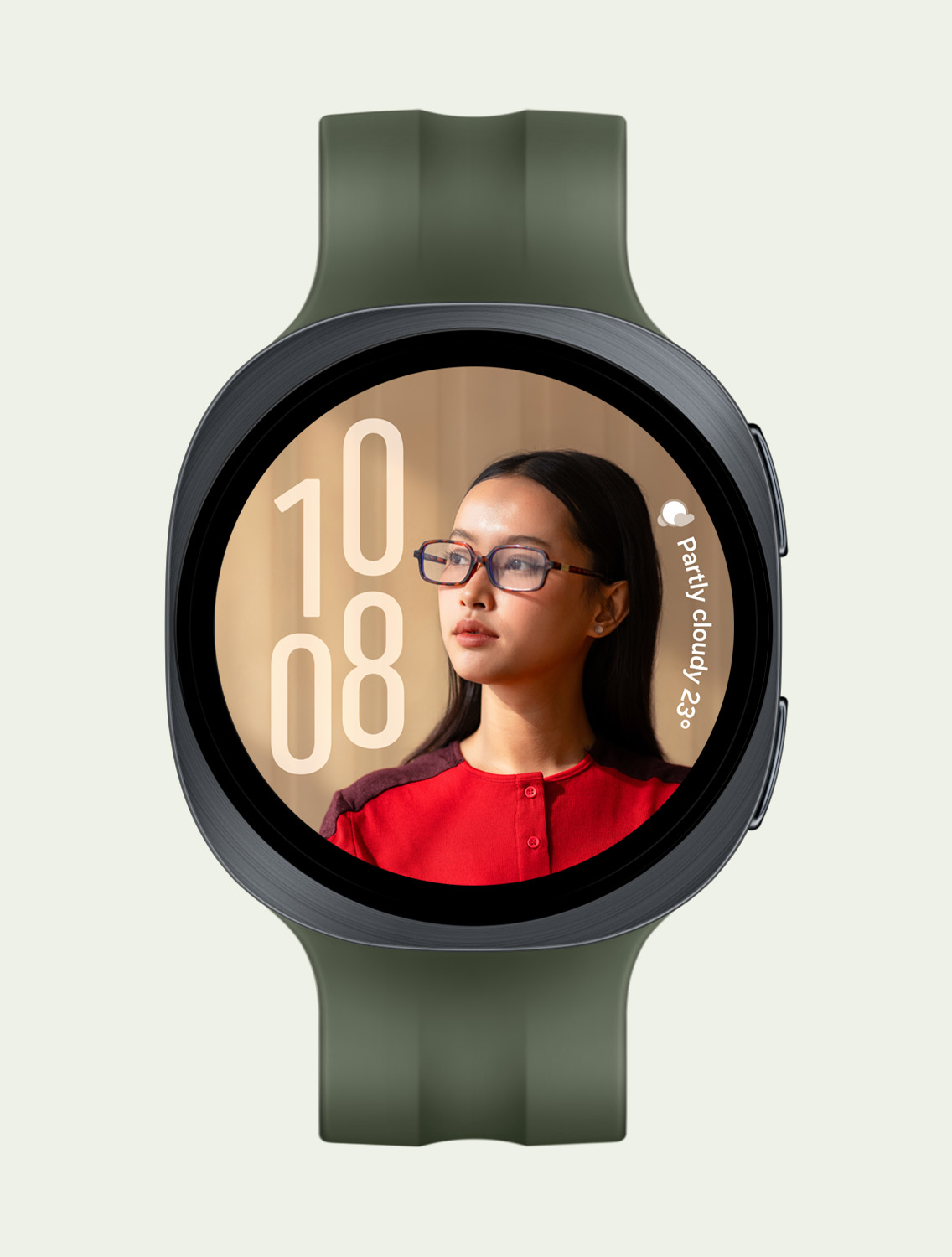 Front view and close-up angled view of Galaxy Watch9 with a Sport Band in Olive, displaying a custom Portrait Watch Face with the time on the left and weather on the right, without overlapping with the person's face.