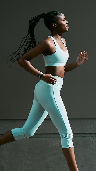A woman can be seen running with Galaxy Watch6 on her wrist.