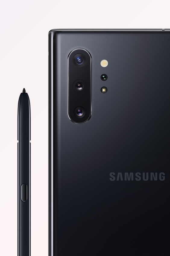 Galaxy Note10 plus in Aura Black seen from the rear, close up on the quad rear camera, next to the black S Pen
