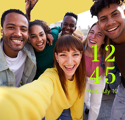 The clock style features a photo of a group of people.