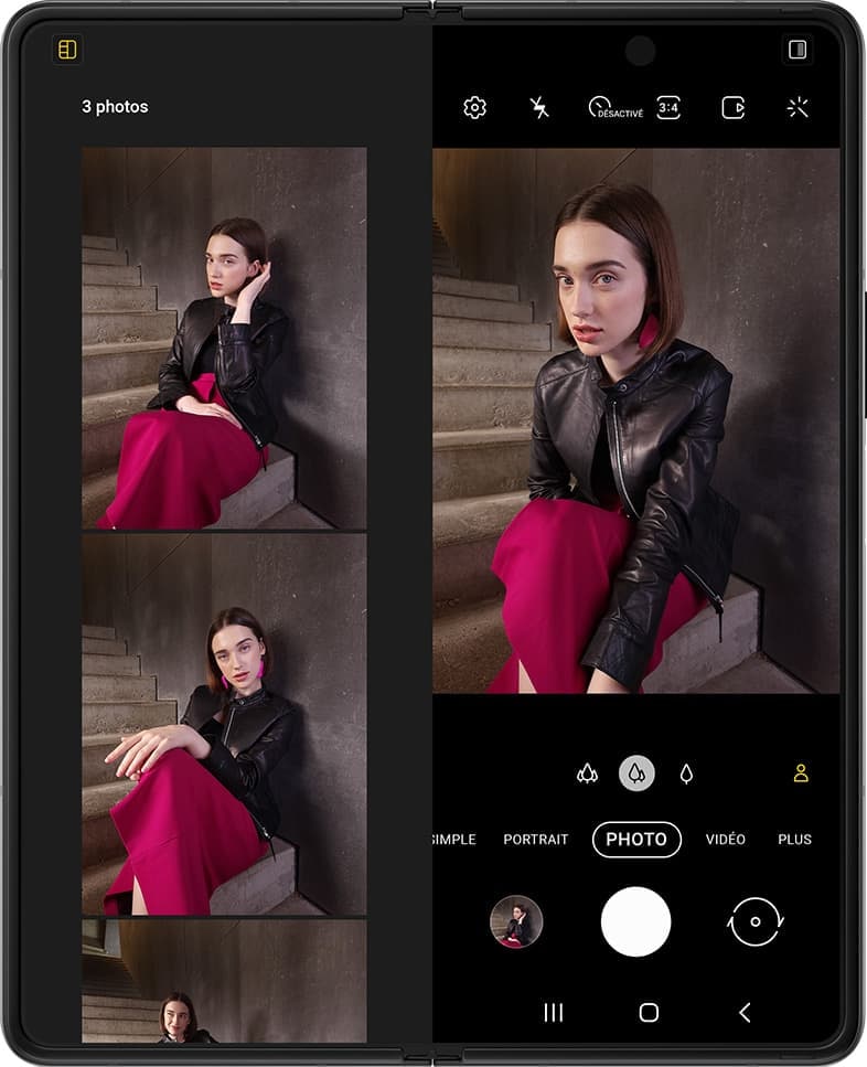 Une femme assise sur des escaliers. Une autre pose apparaît, puis une autre. Les photos flottent au-dessus du Galaxy Z Fold3 5G déplié. Elles tombent en place l'écran à l'intérieur du mode Vue capture dans l'app Appareil photo. Le compteur indique 2 photos. L'obturateur se déclenche et une autre photo est prise sur le Galaxy Z Fold3 5G, et les photos se déplacent à nouveau pour montrer une vue plus grande des photos qui viennent d'être prises. Le compteur indique maintenant 3 photos.