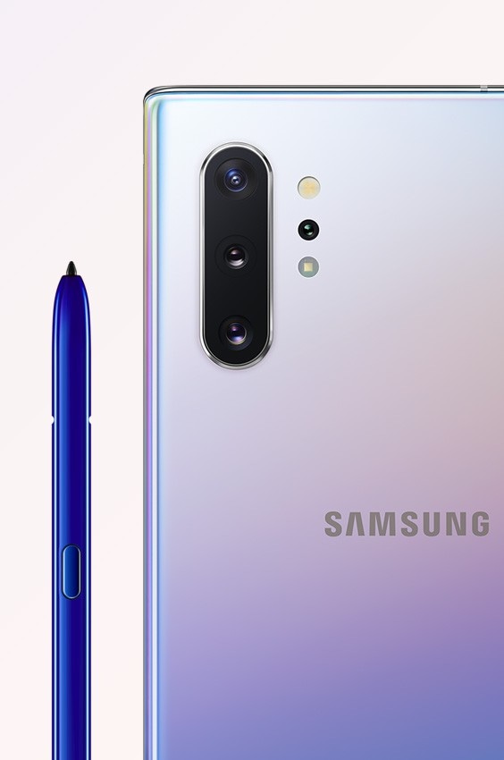 Galaxy Note10 plus in Aura Glow seen from the rear, close up on the quad rear camera, next to the blue S Pen