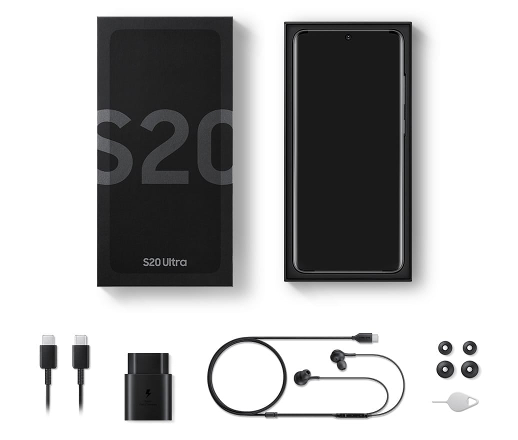 A flat lay of the items included in box with Galaxy S20, S20 plus, and S20 Ultra. The packaging, the device, the USB Type-C cable, travel adapter, headphones, earbud tips, and a SIM tray ejector