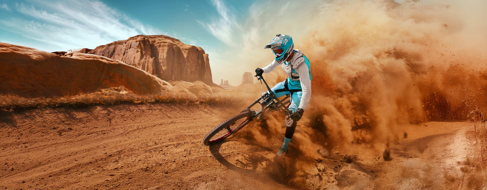 A person cycling in the desert with full cycling gear and Galaxy Watch Ultra on the wrist.