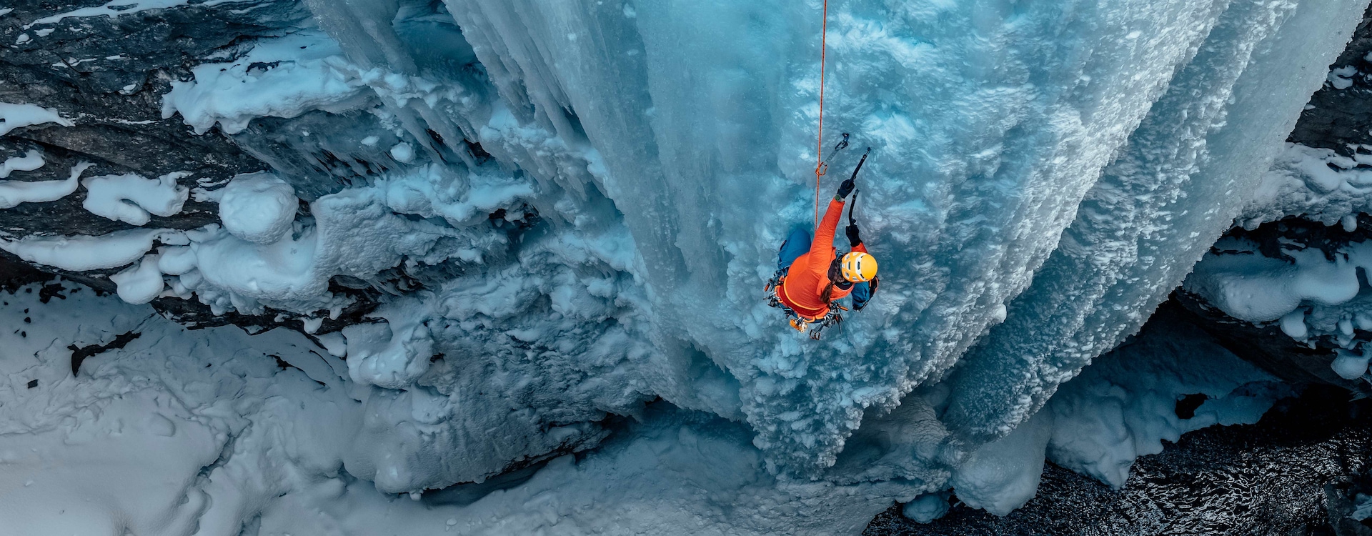 A person is ice climbing. On one wrist is Galaxy Watch Ultra.