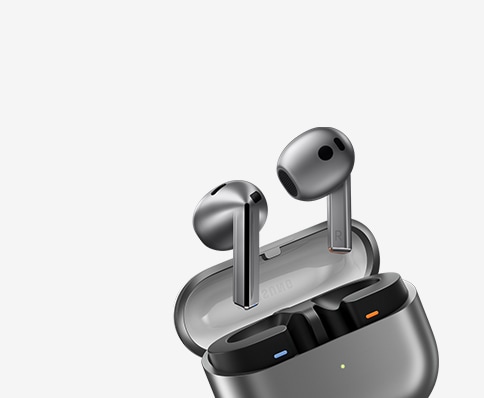 The image showcases a pair of Samsung Galaxy Buds3 wireless earbuds partially visible in their charging case. With a sleek, minimalist design in a stylish gray finish, these audio accessories highlight both functionality and aesthetic appeal.