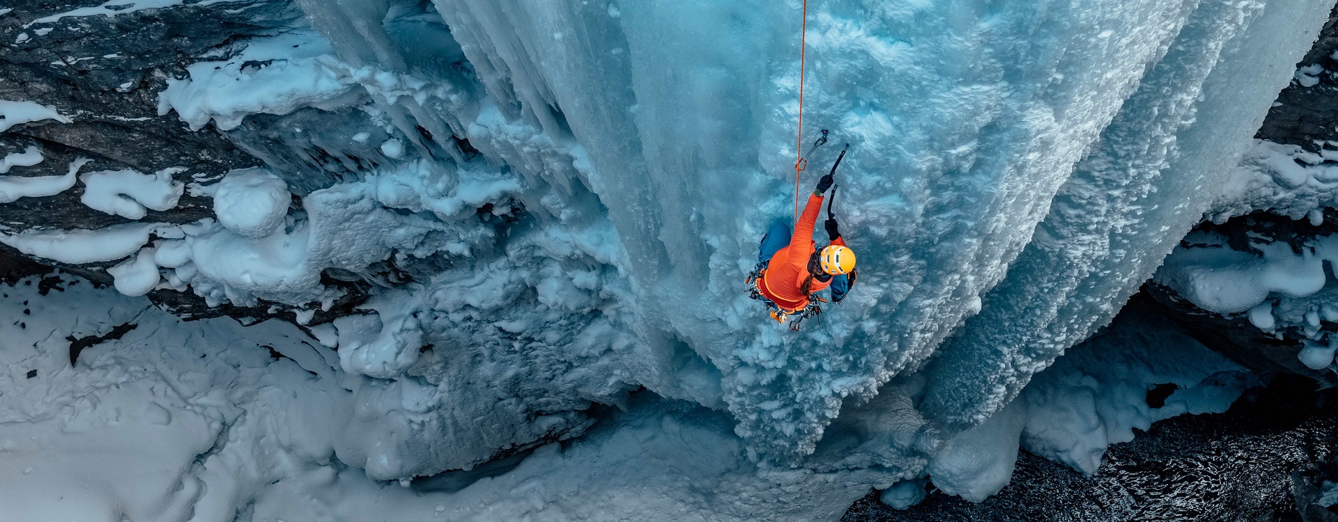 A person is ice climbing. On one wrist is Galaxy Watch Ultra.