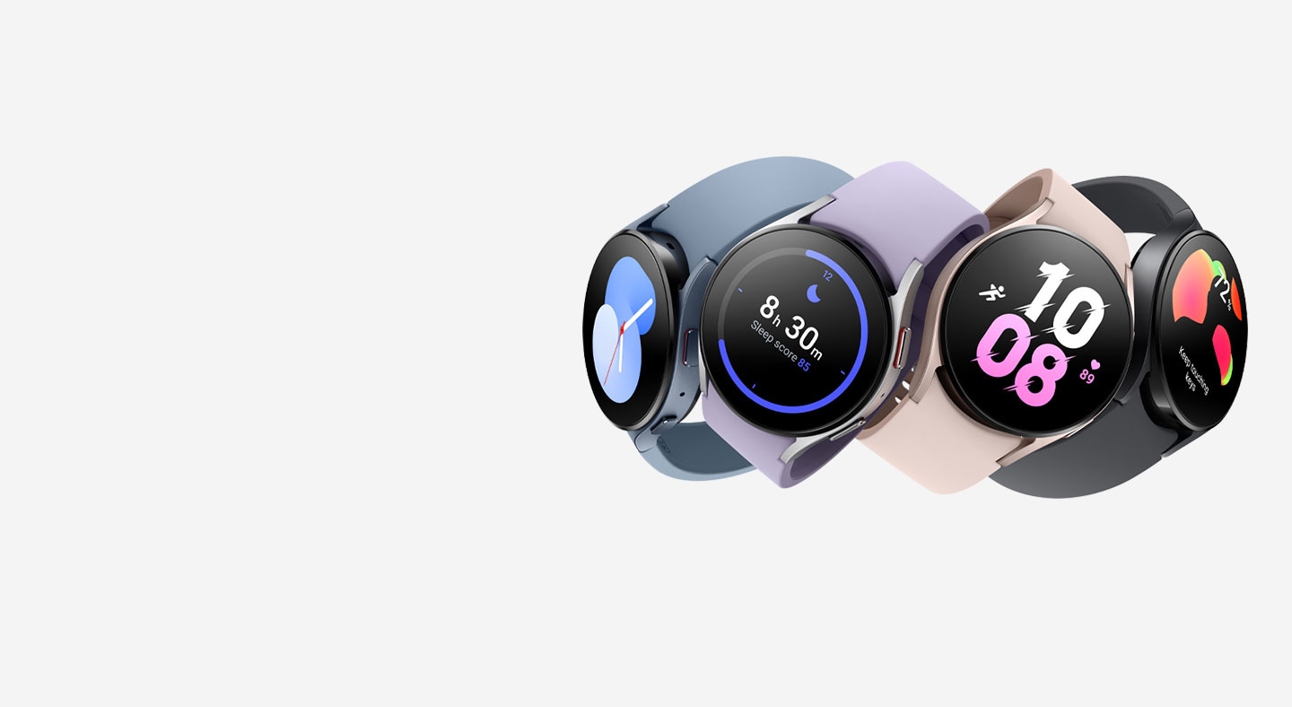 Four Galaxy Watch5 devices are stacked on top of each other in four different colors (Graphite, Pink Gold, Silver, and Sapphire). Each showcase a different interactive watch face to tell the time. Each watch has a different color watch band, from Black to Pink to Violet to Navy.