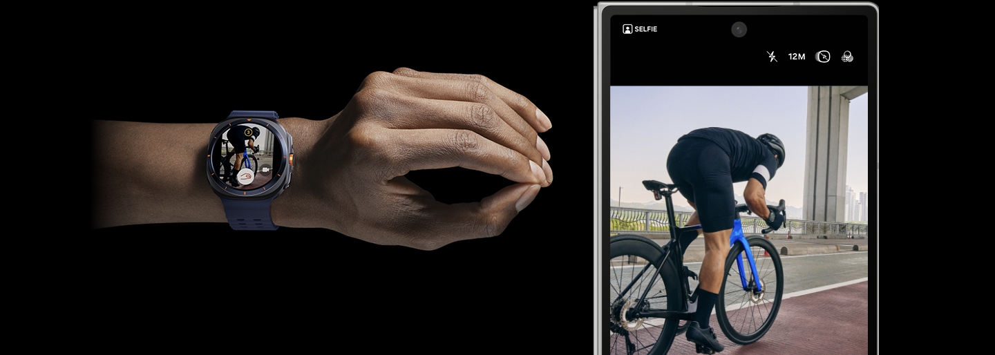 A hand wearing a Galaxy Watch Ultra is making a Double Pinch motion. Next to it is the paired Galaxy Z Fold6 with its Cover screen featuring a camera screen capturing a man cycling.