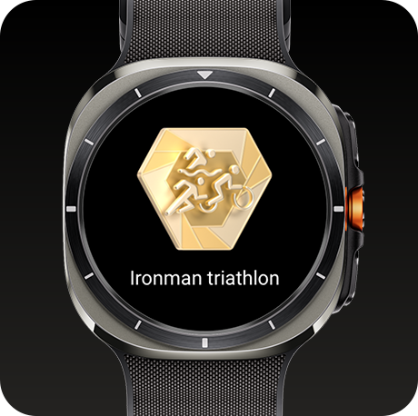 A Galaxy Watch Ultra displaying a milestone badge and a text of 'Ironman triathlon'.