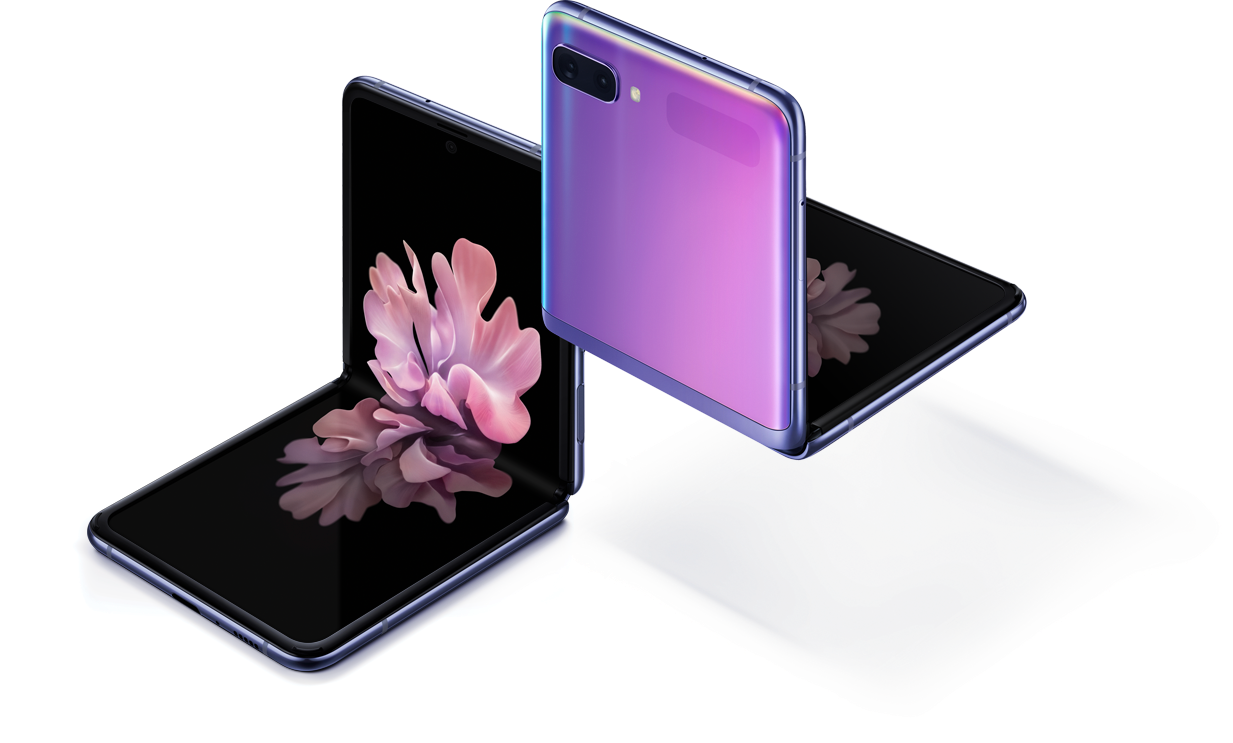 Two Galaxy Z Flip phones in Mirror Purple at a three-quarter angle, one seen from the front and one seen from the rear. Both are folded at right angles with freestop folding. The one seen from the front has the blossoming flower wallpaper onscreen
