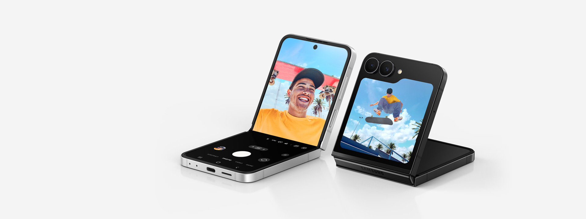 Two Galaxy Z Flip7 FE devices are seen, one in Black and one in White. Both devices are in FlexMode, one is seen from the cover screen and the other is seen from the main screen. Galaxy AI.
